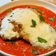 Alta Via signature dishes Chicken ParmesanPumpkin RavioliLittle Gem Romaine Salad